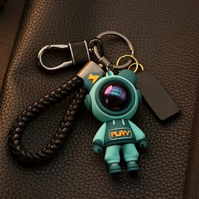 Cute Astronaut Keychains: Lightning & Cartoon Spaceman Designs For Couples, Silicone Style With Red Helmets, And Crystal-Embellished Alloy Versions - Maximus Echo